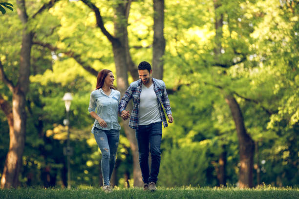 young couple walking in a park