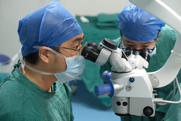 Ophthalmolologist teaching residents surgery
